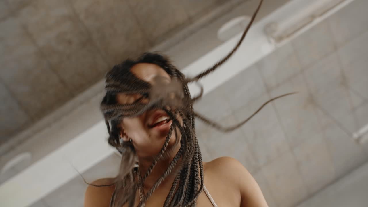 Woman Dancing with Braids