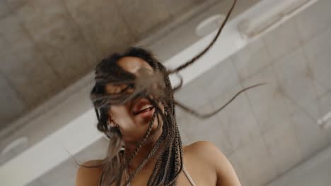 woman dancing with braids