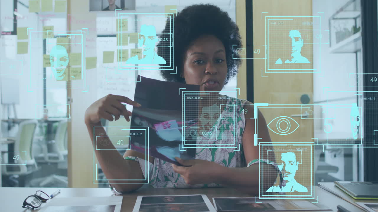 Animation of data processing with portraits over african american businesswoman having video call