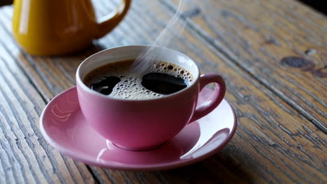 hot coffee on a wooden table