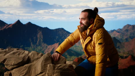 proud explorer celebrates on top of a high altitude mountain peak