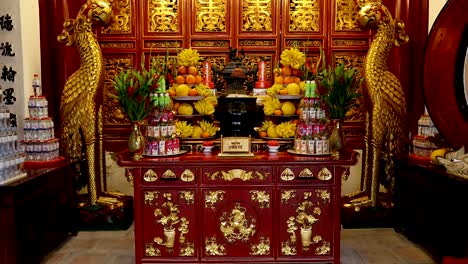 ornate altar with offerings and statues