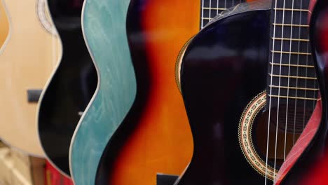 closeup of acoustic guitars in a shop