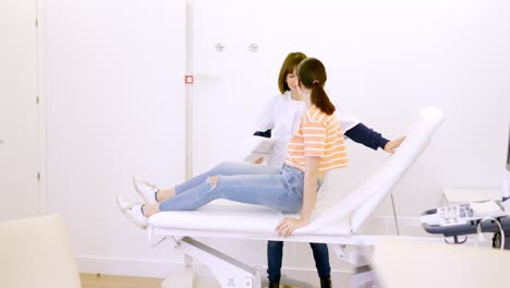 Patient lying on a stretcher attended by a friendly nurse