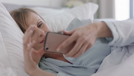 beautiful-woman-using-smartphone-in-bed-texting-sharing-social-media-messages-enjoying-online-connection-relaxing-at-home