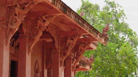 details and carvings of red buddhist temple in koh samui