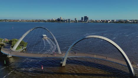 Aerial-drone-forward-moving-shot-over-newly-constructed-Elizabeth-Quay-Bridge-in-Perth,-Western-Australia-on-a-sunny-day