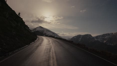 walking forward down the empty road in rocky mountain national park on trail ridge road.