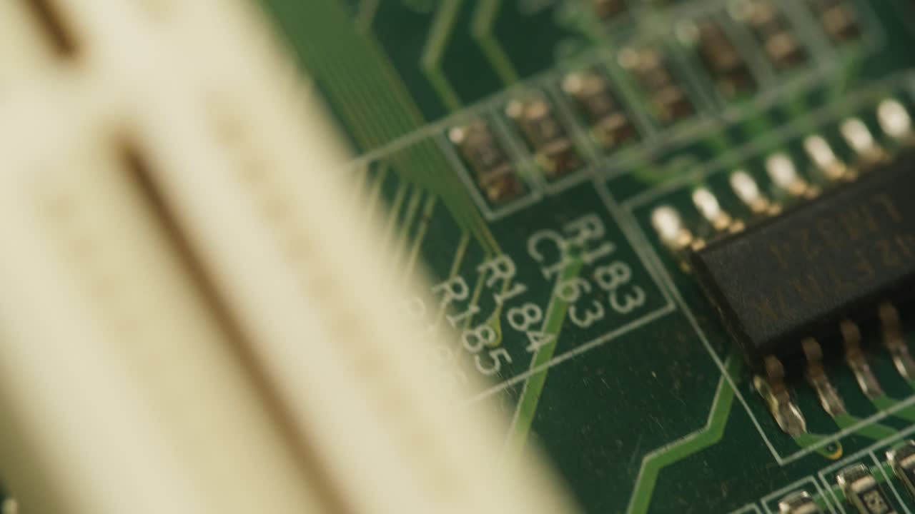 Close Up Macro Shot of Green Circuit Board Components