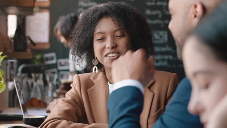 diverse-business-people-working-in-cafe-chatting-sharing-ideas-planning-deal-enjoying-collaborating-in-busy-coffee-shop-at-lunch