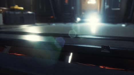 light beams illuminate a futuristic corridor in a science fiction setting