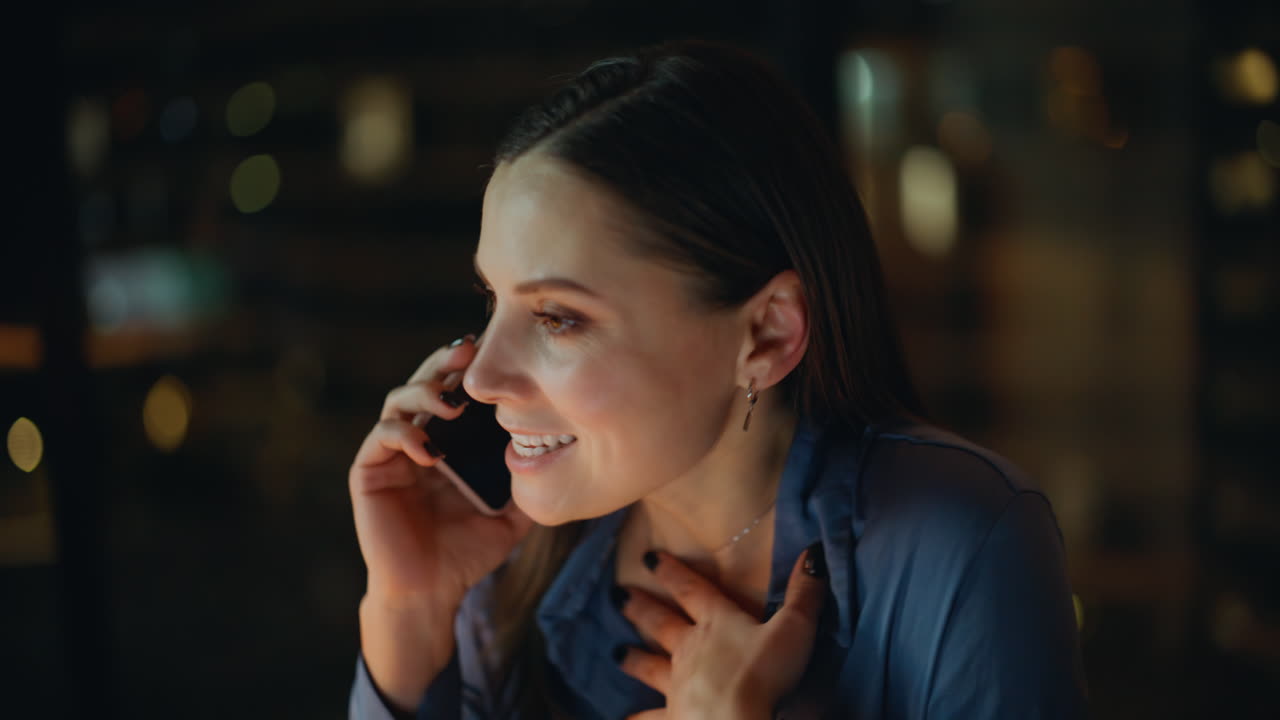 Angry ceo talking smartphone at night office closeup. Worried woman calling
