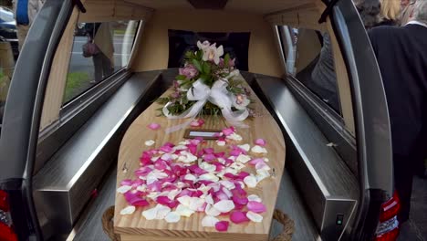 closeup-shot-of-a-funeral-casket-in-a-hearse-or-chapel-or-burial-at-cemetery