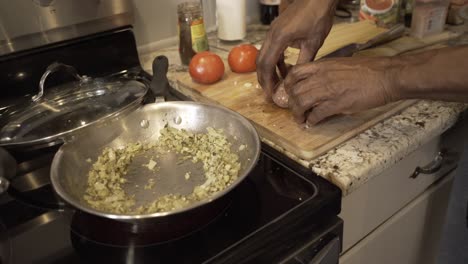 adding-beyond-vegan-meatballs-to-pan-Preparing-ingredients-to-make-vegan-beyond-meatballs-with-spaghetti-and-meat-sauce