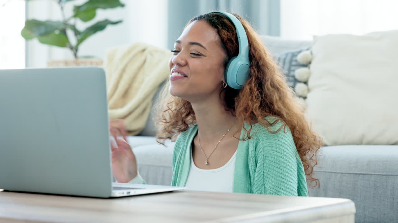 Woman talking on video call using laptop