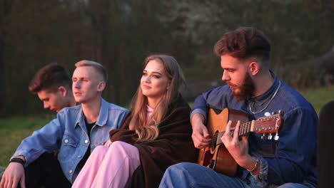 friends enjoying music outdoors