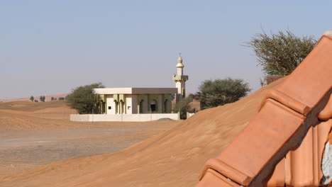 desert mosque in the buried, abandoned ghost village of al madam, sharjah