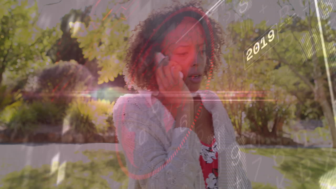 Woman talking on phone with digital data animation overlaying her