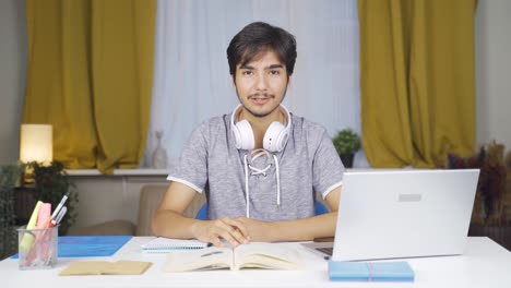 Male-student-speaking-to-camera.