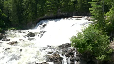 Water-rushing-down-river-in-green-vivid-forest