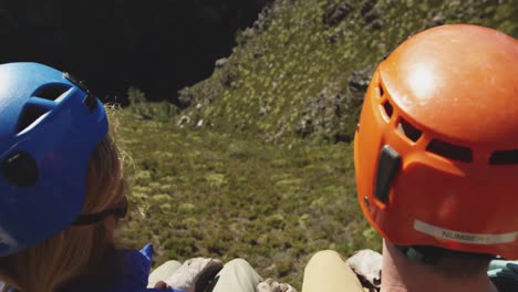 young caucasian couple in helmets