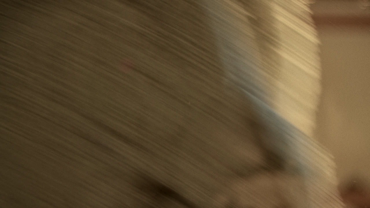 Blurred Close-up of a Man's Face Through a Distorted Surface