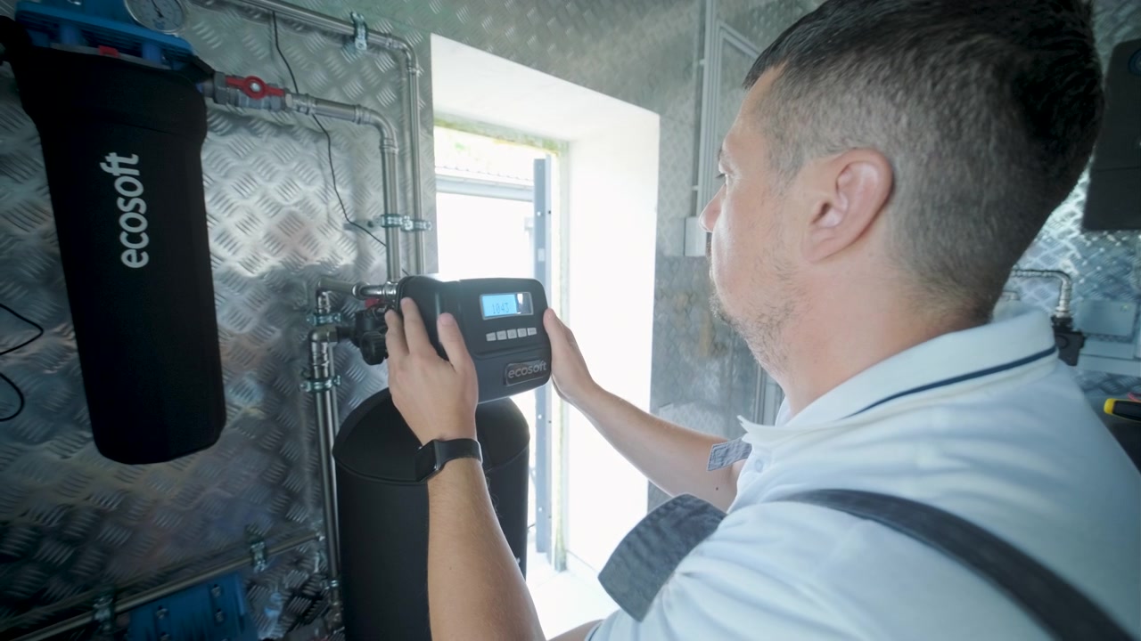 Technician Installing Water Filtration System Control Valve