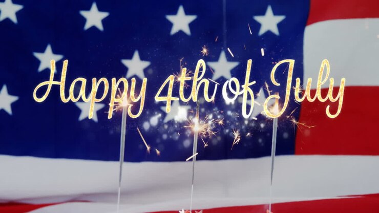 Happy 4th of July text and an American flag with sparkles on cupcakes