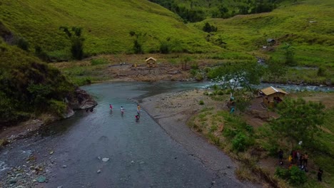 Drone-Shot-of-people-swimming-in-a-river