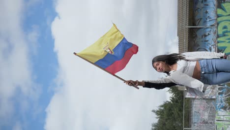 vertical video patriotic woman from latin america holding ecuador flag