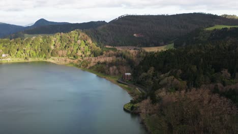 circling drone footage of the chapel of nossa senhora das vitórias on lake furnas on the azores islands