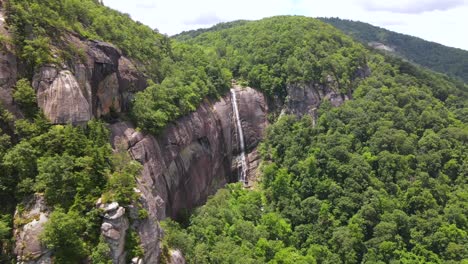 an excellent aerial shot of the greenery surrounding hickory nut falls in chimney rock north carolina