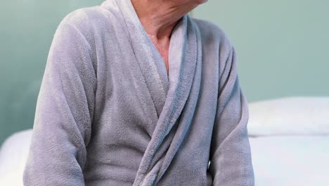 portrait of senior man in bathrobe