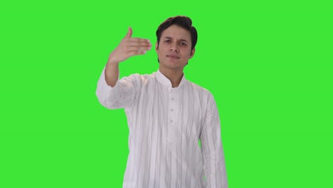 Happy-Indian-man-pointing-and-calling-someone-Green-screen