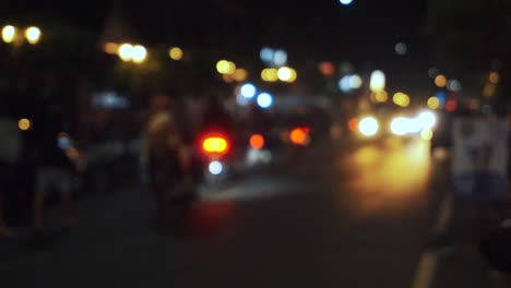 defocused footage of traffic on the street in the night