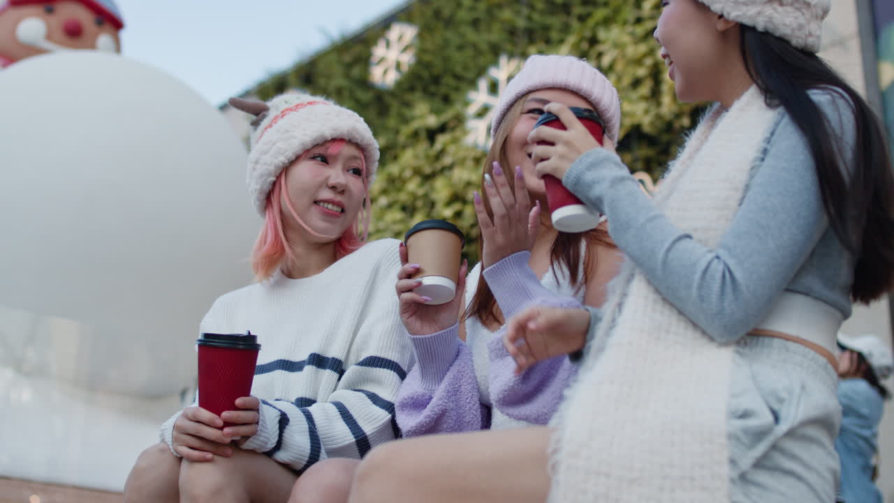 Friends enjoying winter with coffee