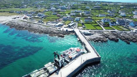 Drone flying over Inisheer harbour aran islands Ireland in a summer morning