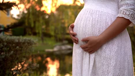 Pregnant-woman-feeling-happy-at-garden-home.