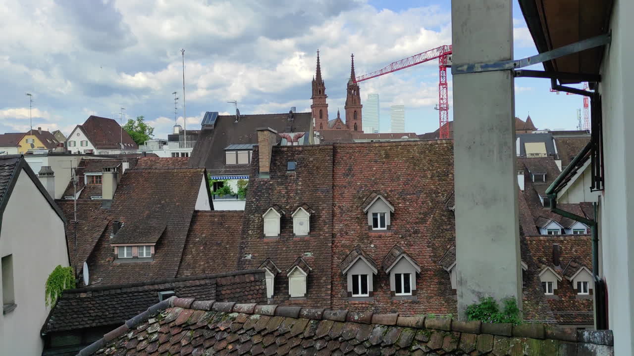 Rooftops and church in Basel, Switzerland. Medieval building style.