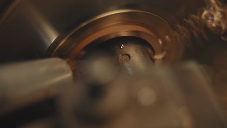 close-up of a metal part being machined on a lathe