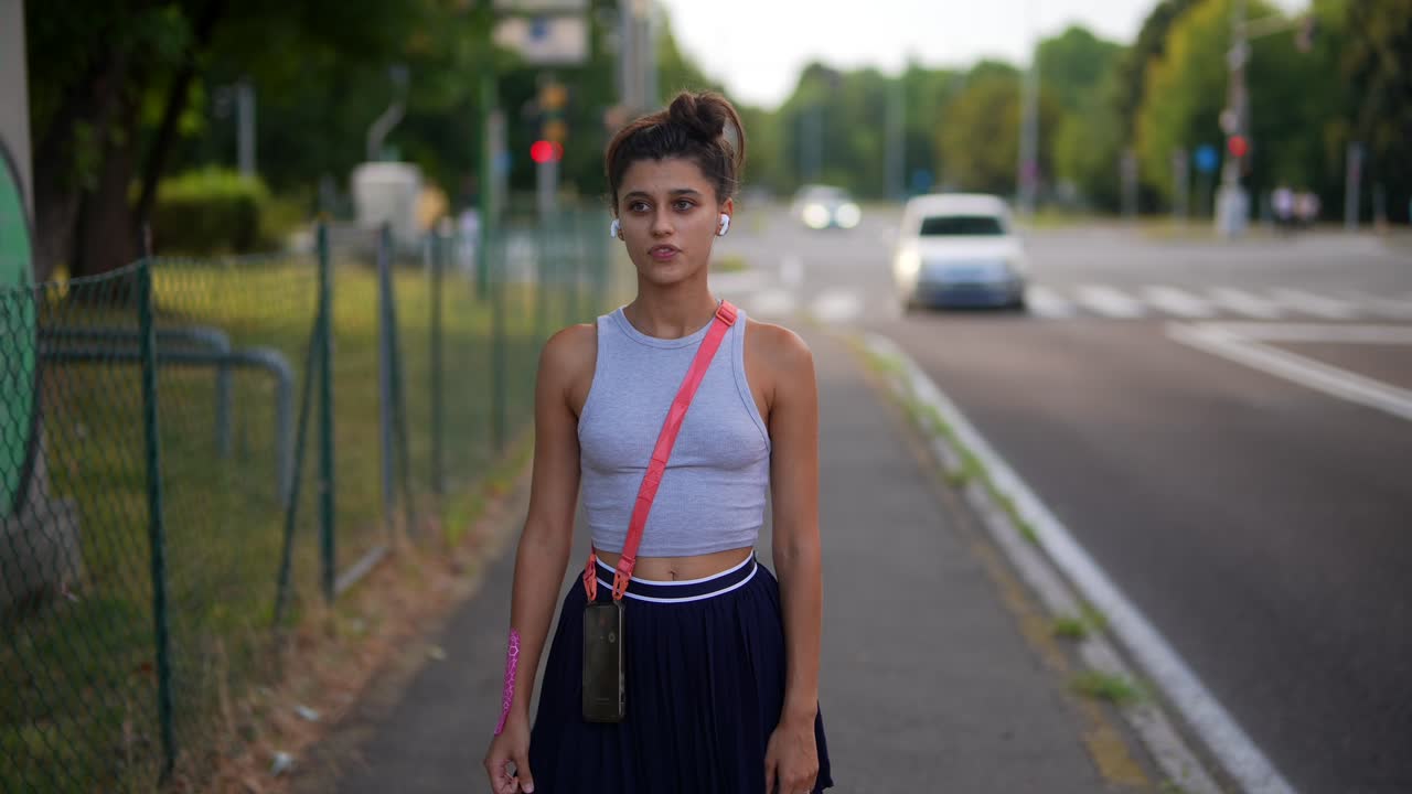 Teenage girl walking on a city street