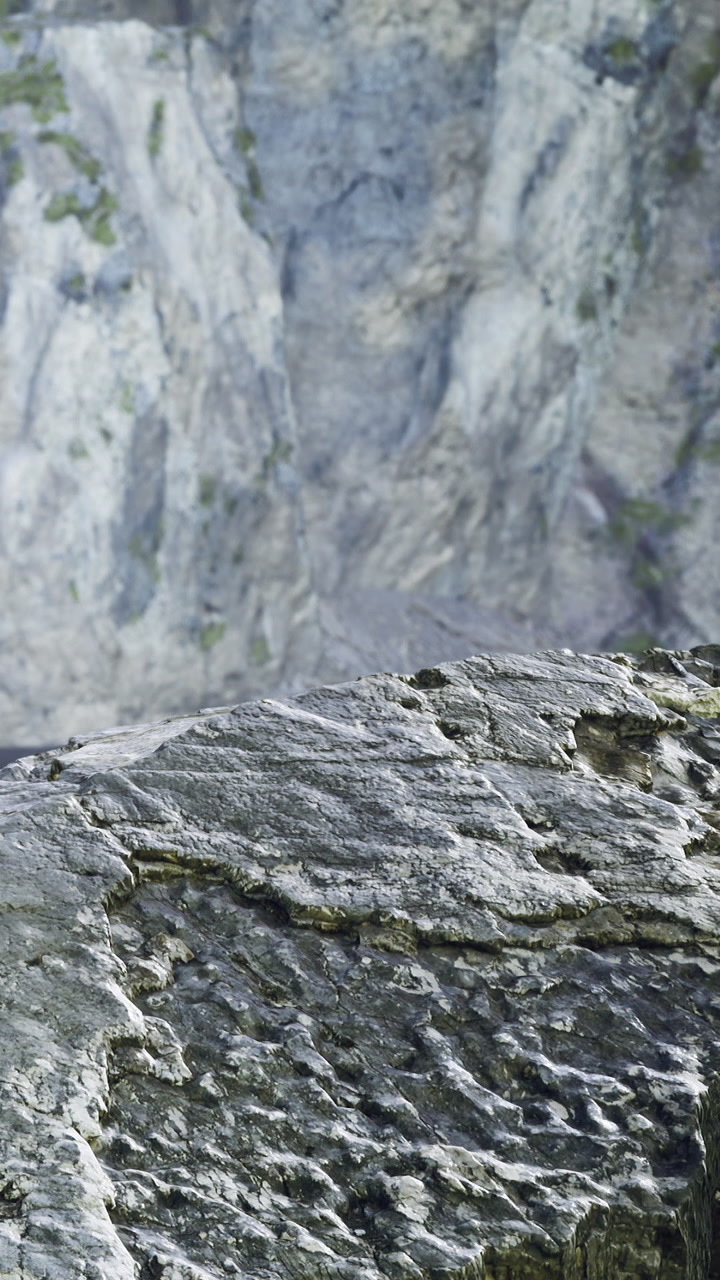 Majestic cliffs and rugged rocks bathed in soft sunlight near the ocean