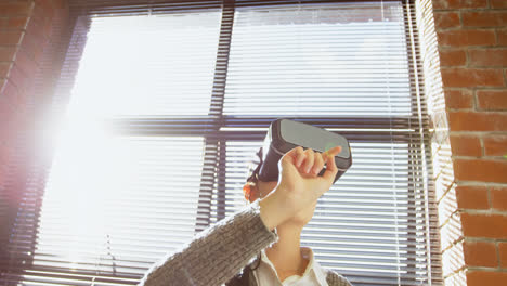 female executive using virtual reality headset 4k