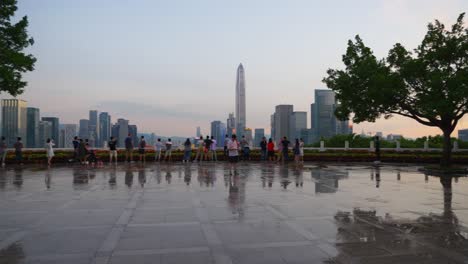 sunset shenzhen downtown park crowded view point wet floor slow motion panorama 4k china