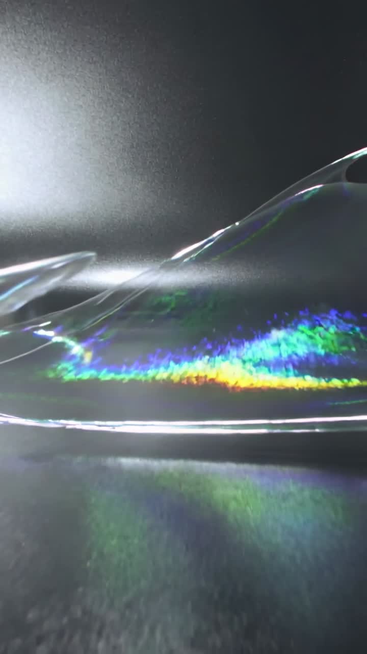 Dynamische holografische vloeistofgolf met regenboogreflecties