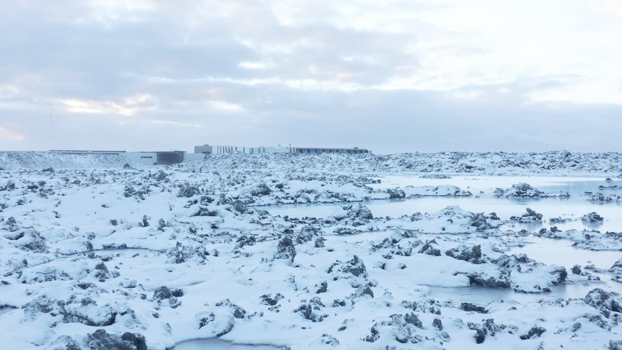Volcanic rocks covered in white snow outside of Blue Lagoon resort, Iceland