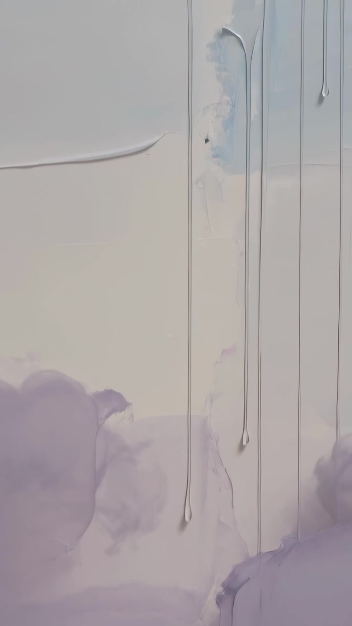 Vertical video: Flowing canvas gravity pulling paint into drips over lavender strokes in studio