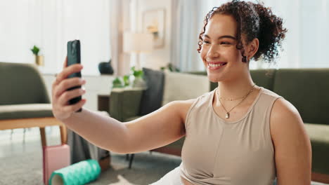 woman using phone at home after yoga