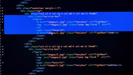 developer is browsing and marking html code on the computer screen