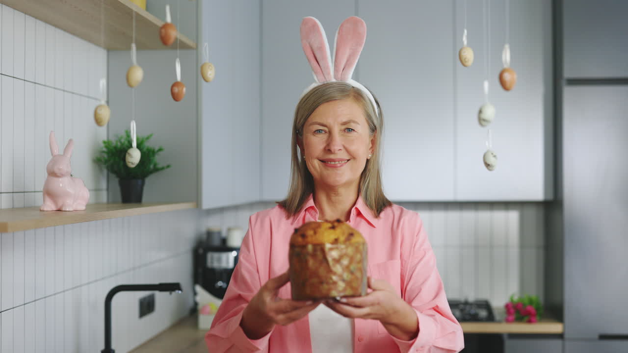 Woman holding Easter bread with bunny ears